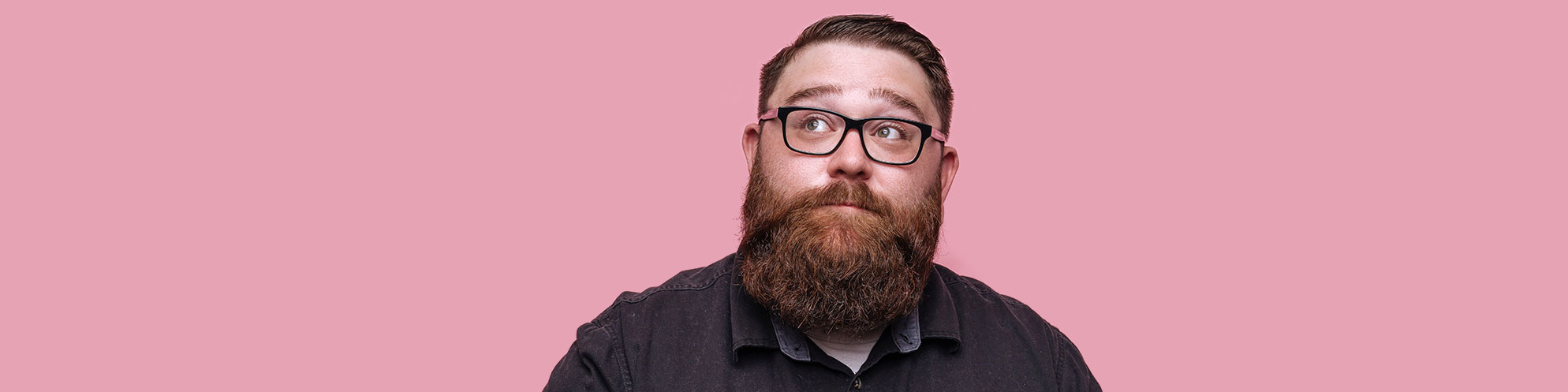 bearded man on a pink background