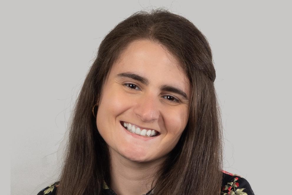 smiling young lady with long dark hair