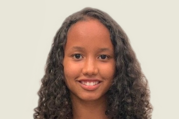 trainee with long curly hair