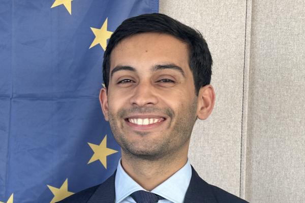 smiling young man on the European flag background